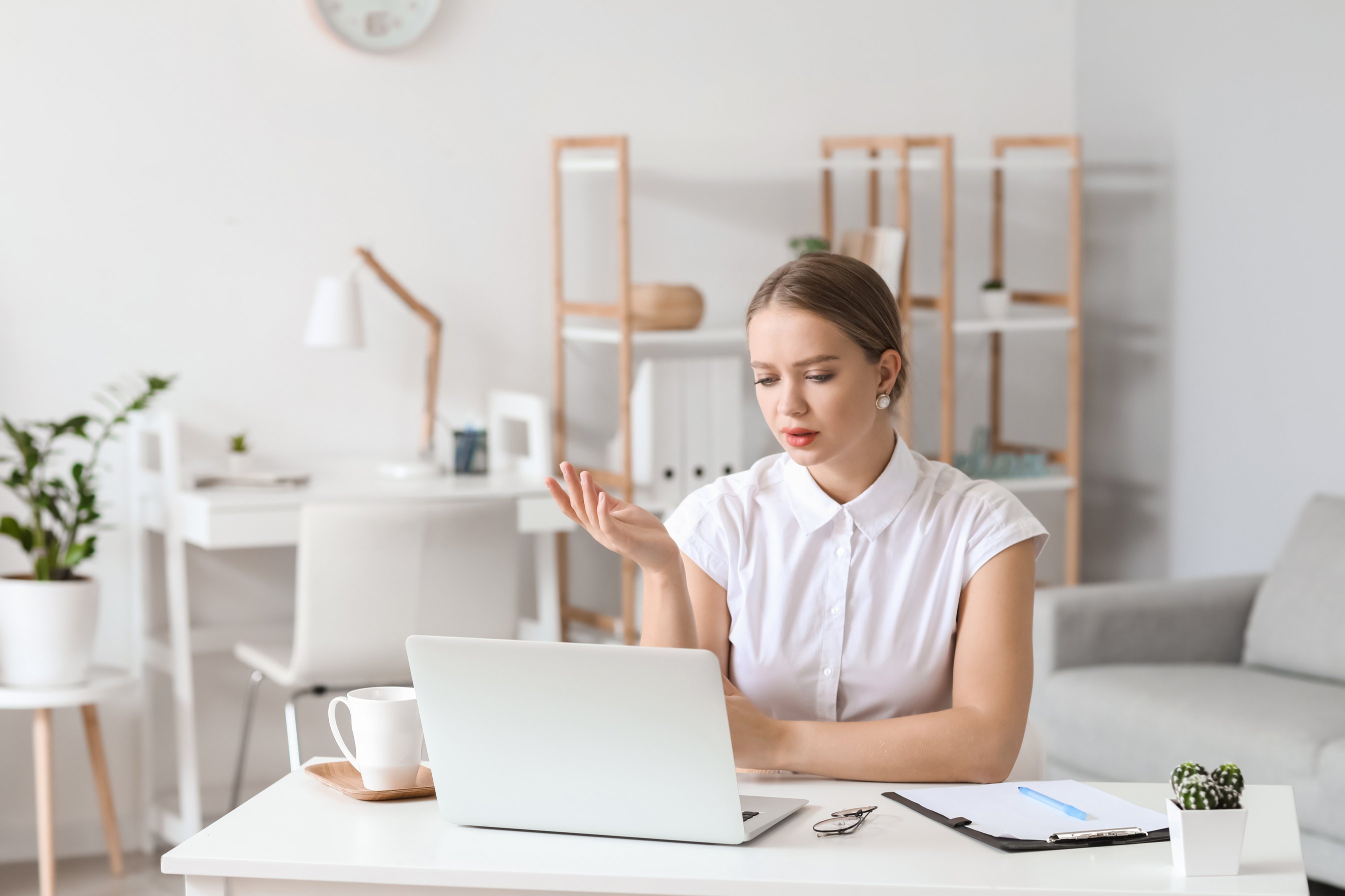 Psychologist Working with Patient Online While Sitting in Office